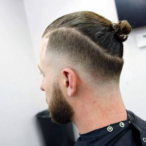 back side of top bun hairstyle for men