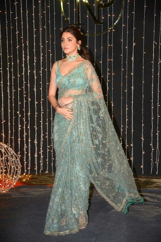 Anushka Sharma in heavily intricates light green embroidered saree, 